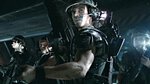 Michael Biehn (center) and a group of space Marines from a scene in Aliens.