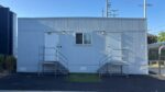 14x30 office trailer side exterior with dual entry doors and wall-mount heat pump - Los Angeles, CA