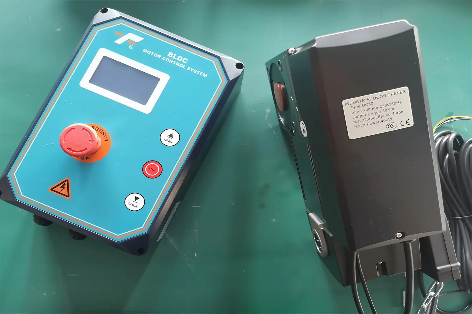 Close-up of a CE-certified industrial sectional door closer motor and a smart BLDC control box, supplied by ABX to provide seamless automatic solutions and eliminate manual reprogramming.