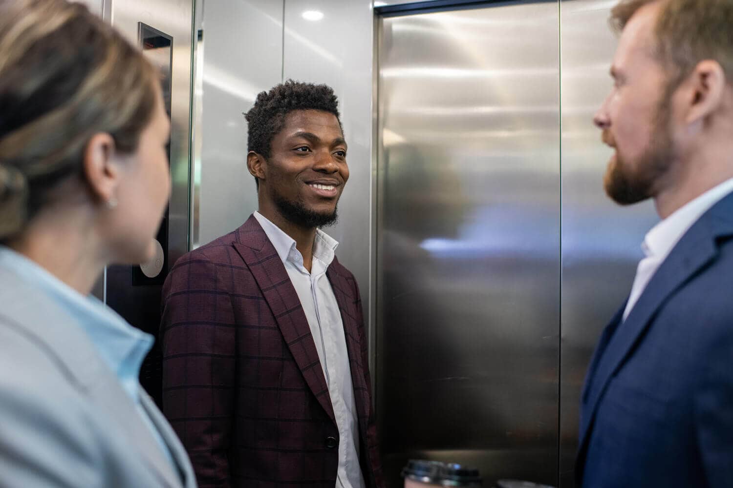 Business people on elevator
