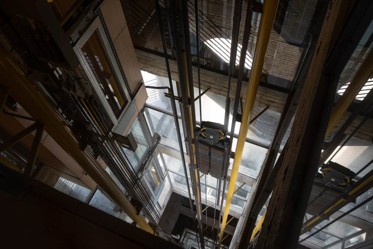 Elevator shaft with guide rails and vertical elevator system components