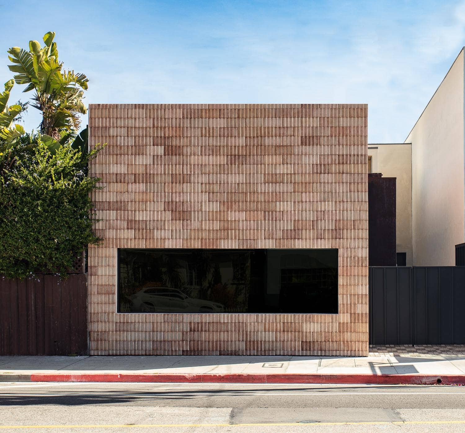Modern residential exterior with a distinctive brick facade.