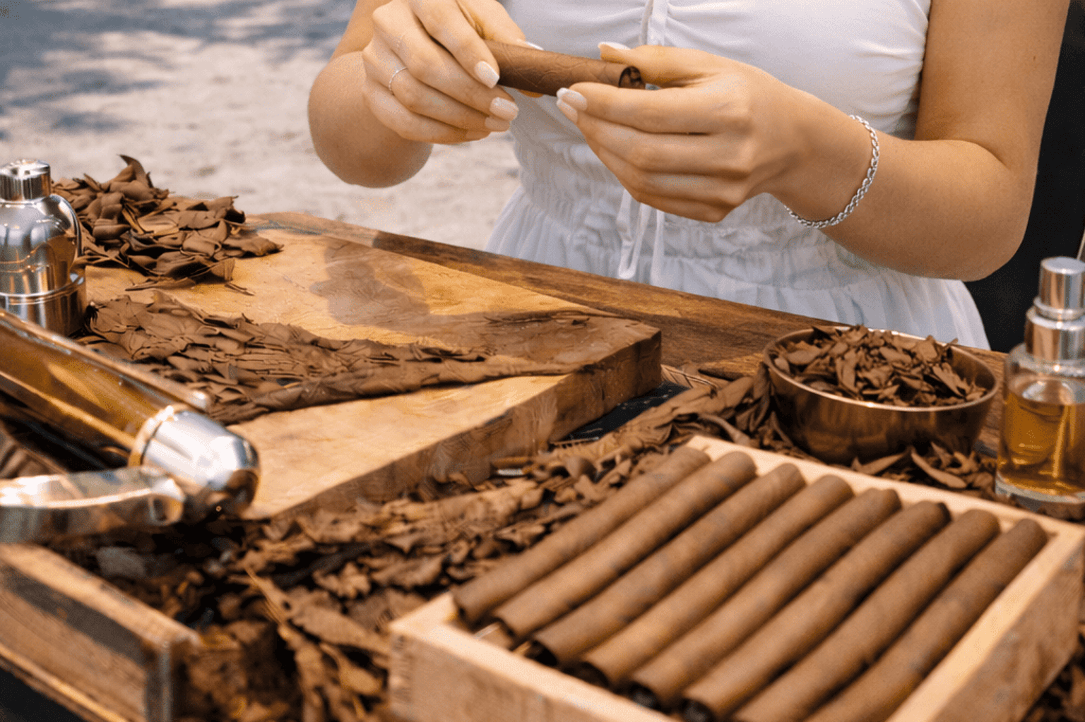 Female cigar roller in Miami creating hand-rolled cigars for a corporate event, wedding, or private party