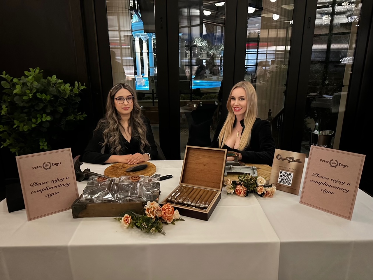 Cigar rollers Houston event inspiration with a professional female cigar roller at a luxury live cigar rolling station