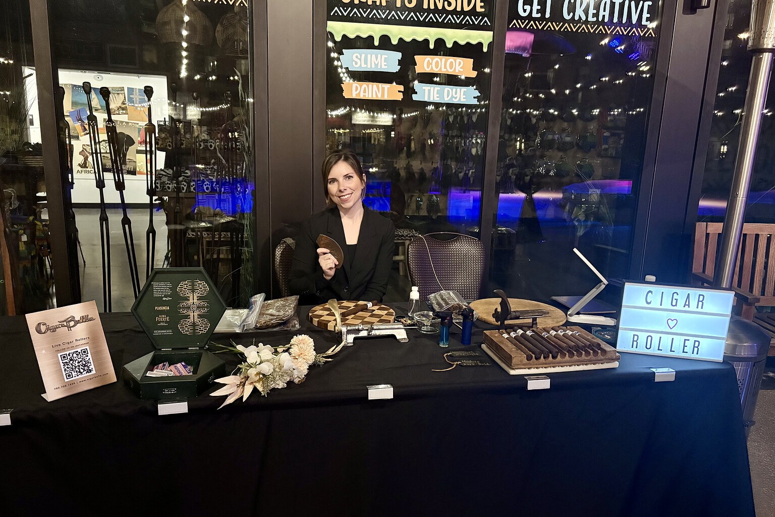 Live cigar rolling station with premium cigars for Houston corporate events, charity galas, golf tournaments, and private parties