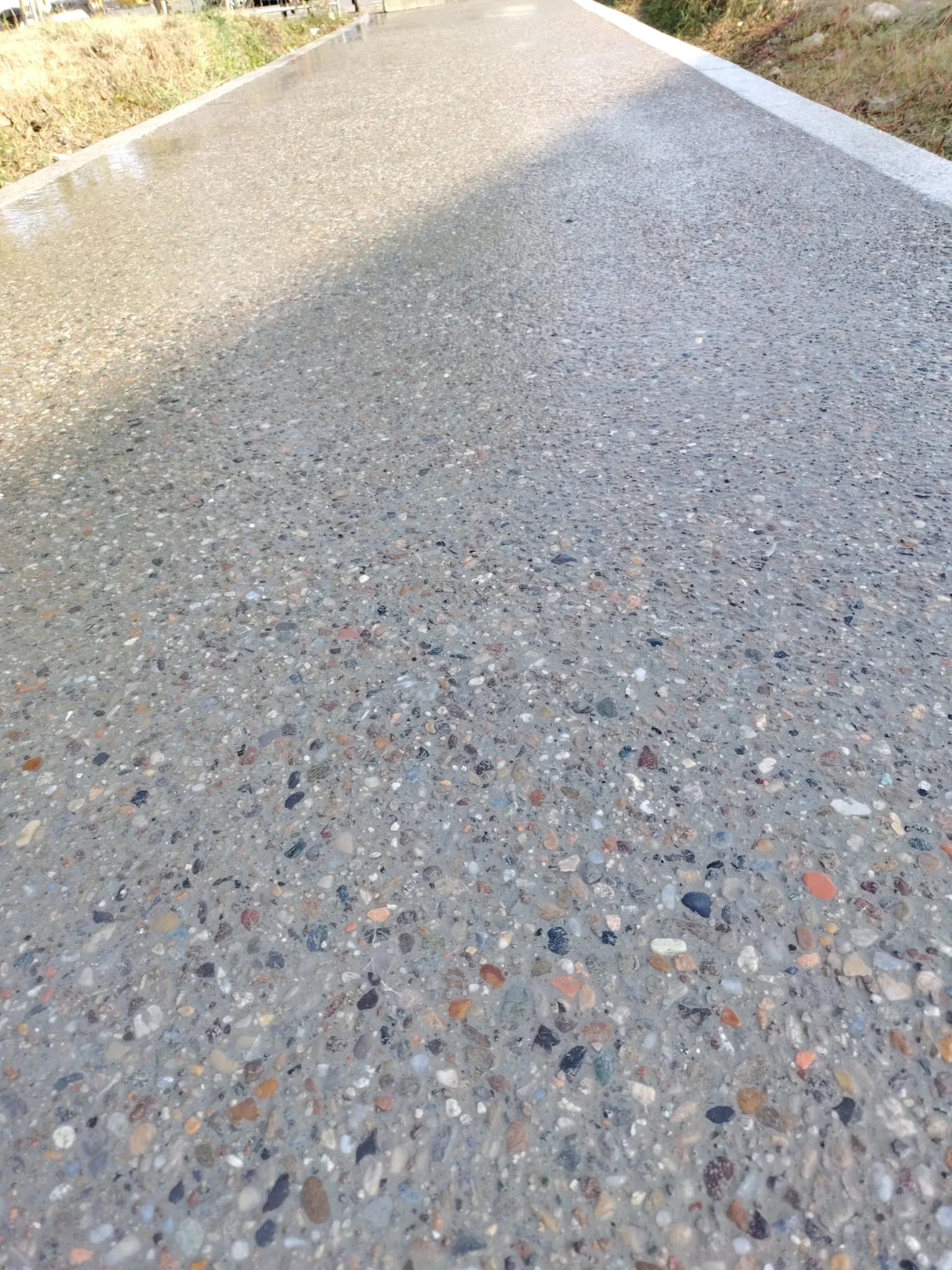 Stazione San Cristoforo M4 Blu Milano con pavimentazione esterna Prima Ground® calcestruzzo architettonico sasso lavato a vista Prima Pavimenti — riqualifica spazi pubblici infrastruttura metropolitana milanese