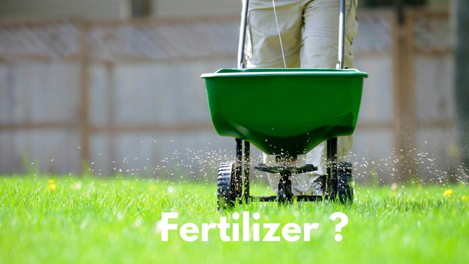 All You Need For A Perfect Fertilizer Spreader Over Green Lawn