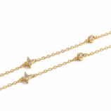 Close-up of the gold Valenne Clover Choker showing bezel-set stones and four-petal clover motifs