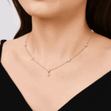 Woman wearing the gold Valenne Clover Choker with moissanite clover motifs by GLAMAVERA