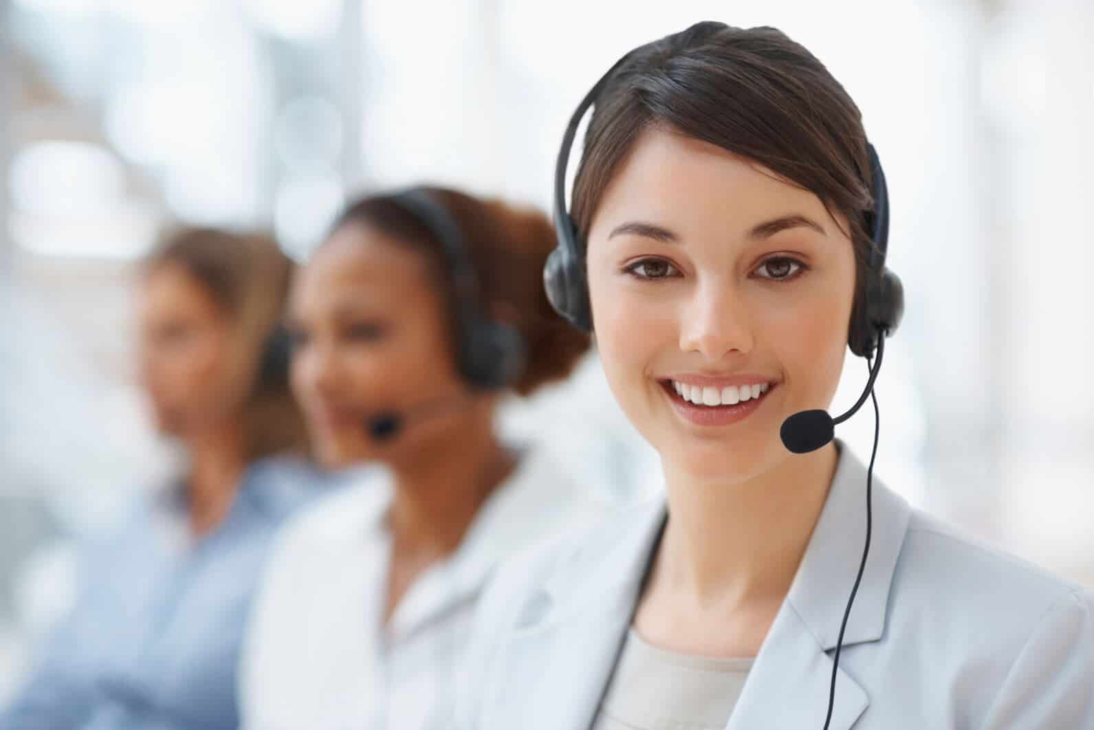 smiling woman wearing headphones with microphone