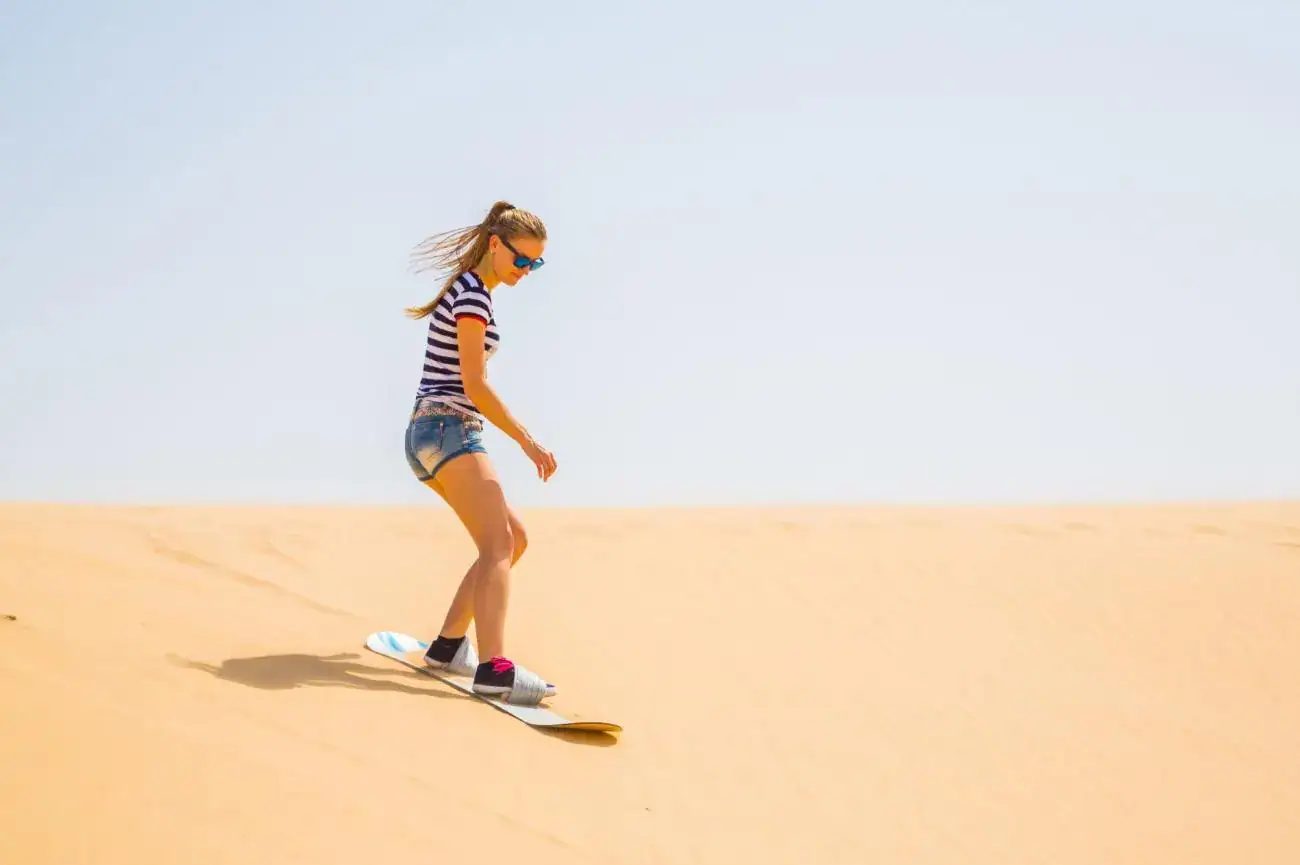 Sandboarding in Great Sand Sea during Siwa desert safari