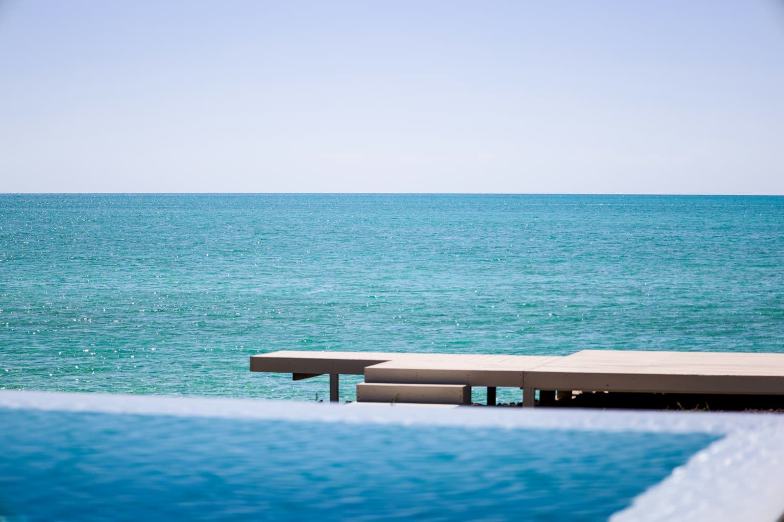 Minimalist waterfront dock at sunrise