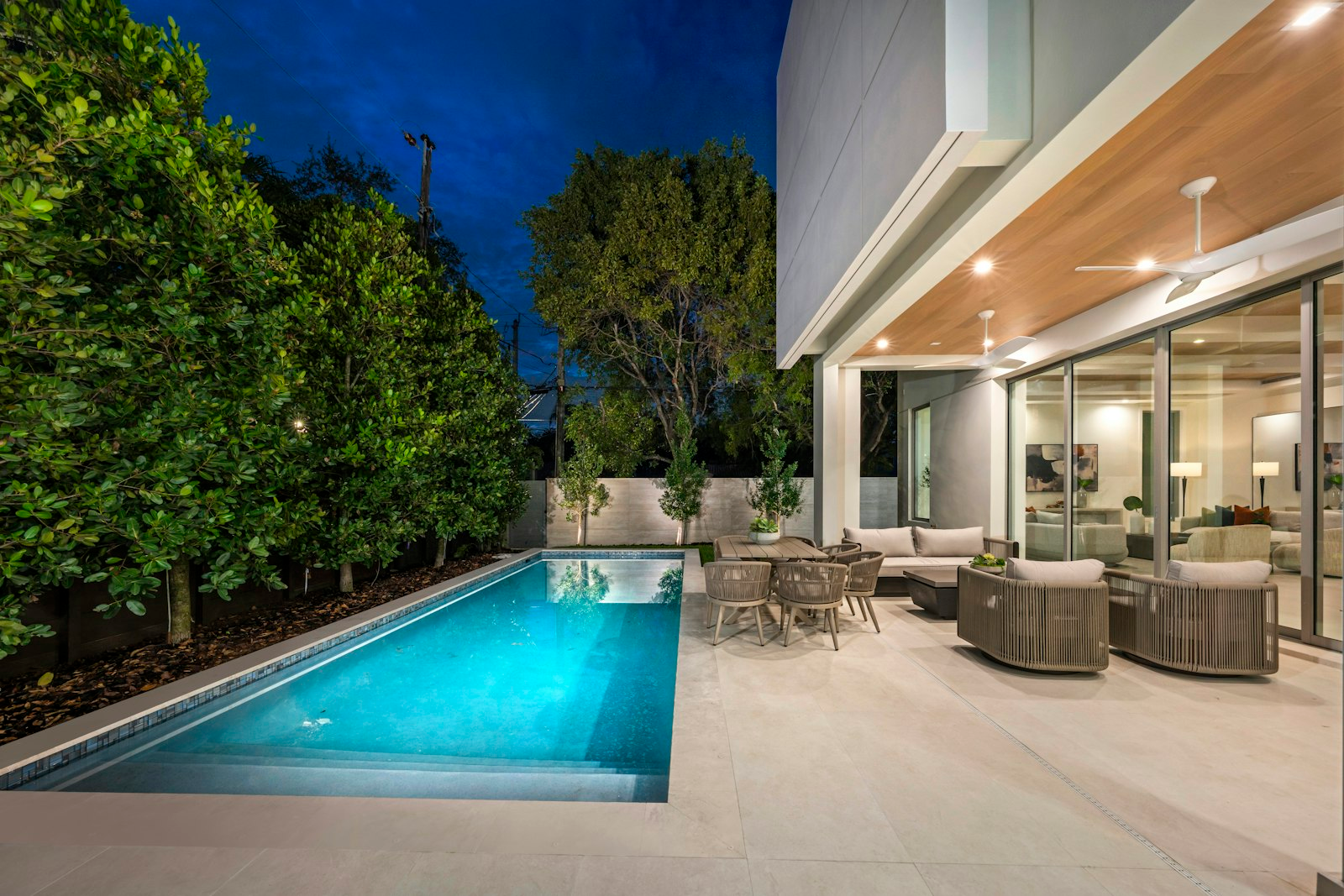 Modern home with a clean backyard swimming pool serviced by Perfect Pools CT