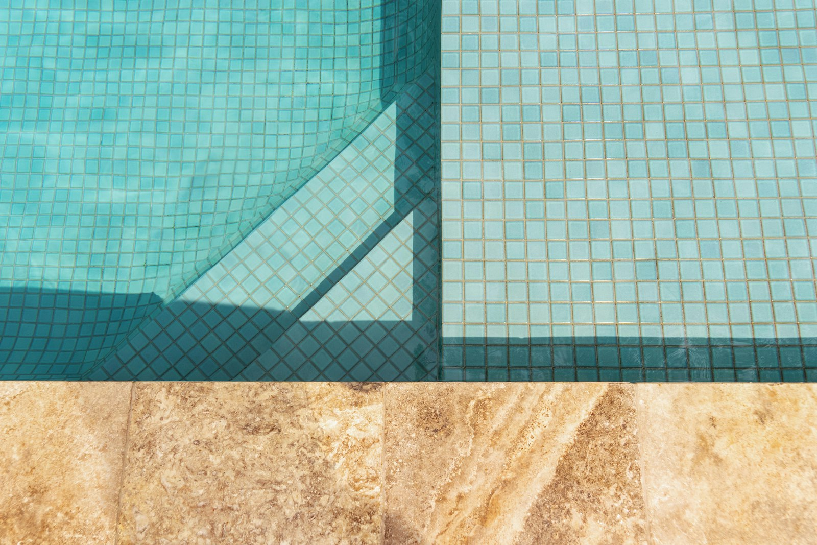 Crystal-clear swimming pool water and tile maintained by Perfect Pools CT