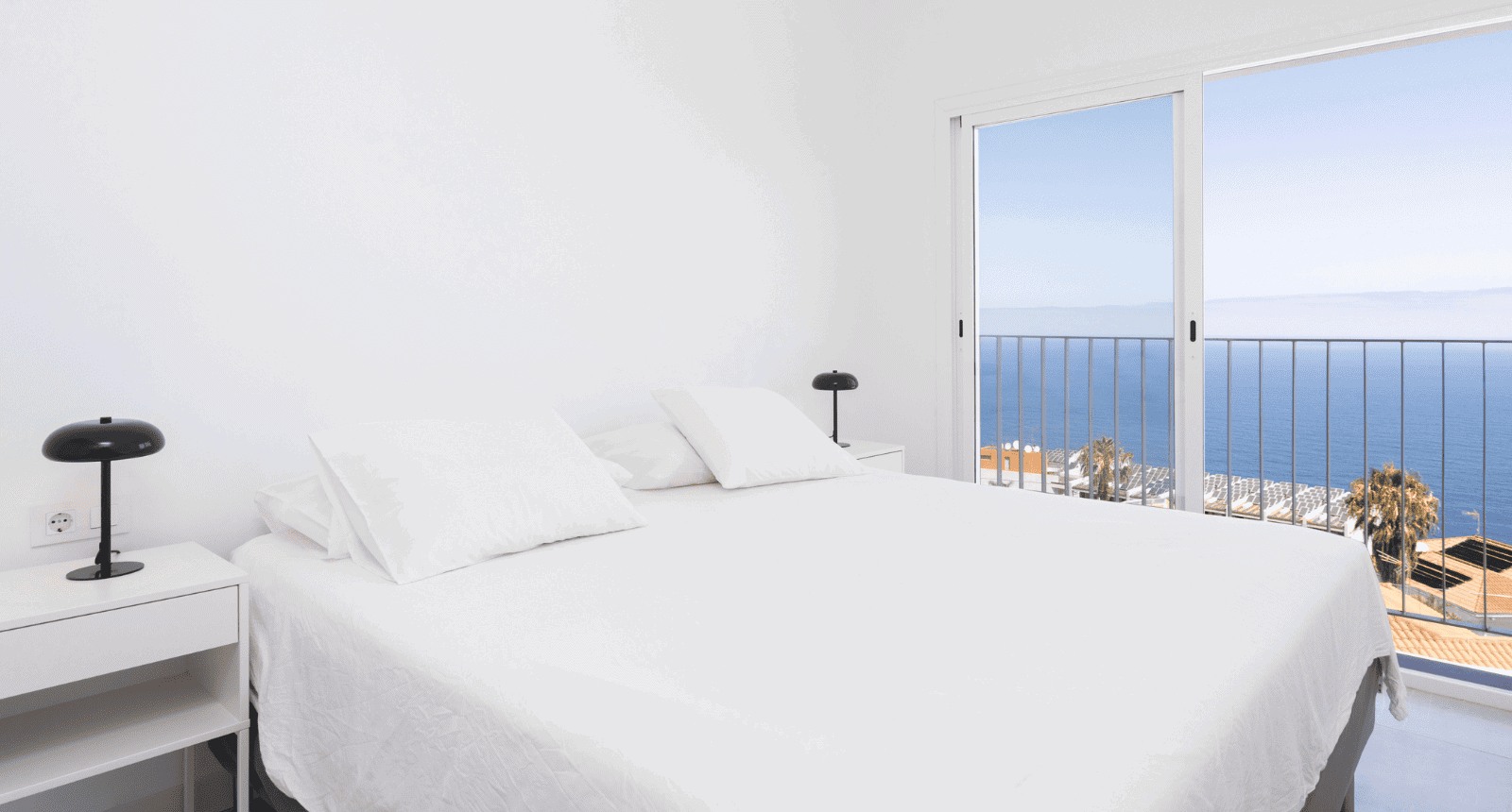 Clean and white bedroom in a luxury villa in Tenerife Property Management