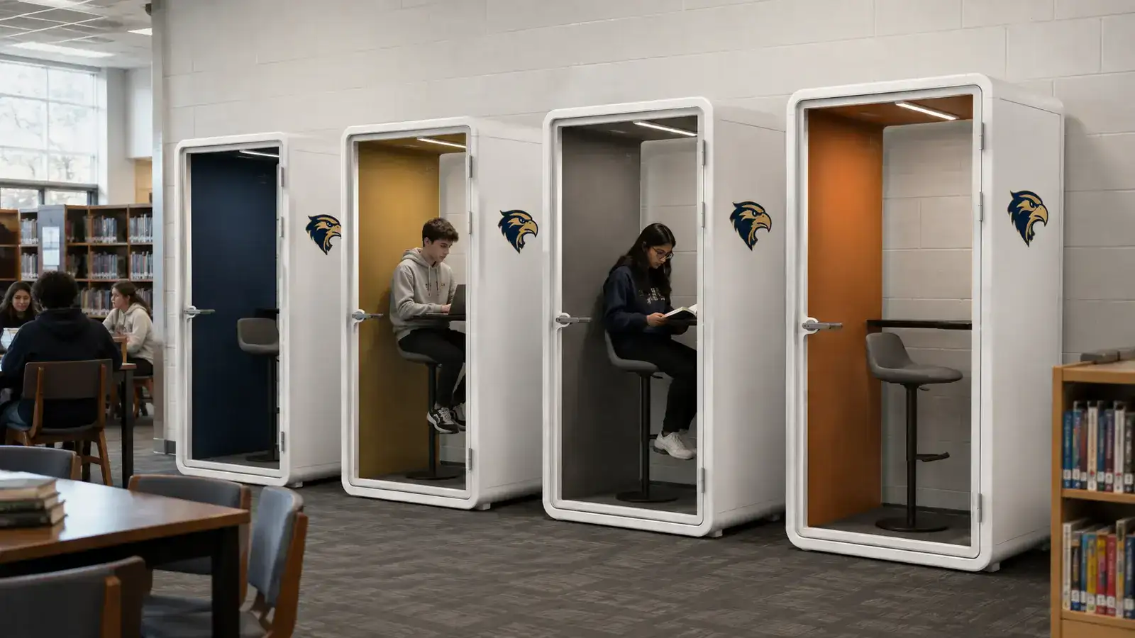 Four Claritycastle Student Pods Installed Along A School Library Wall