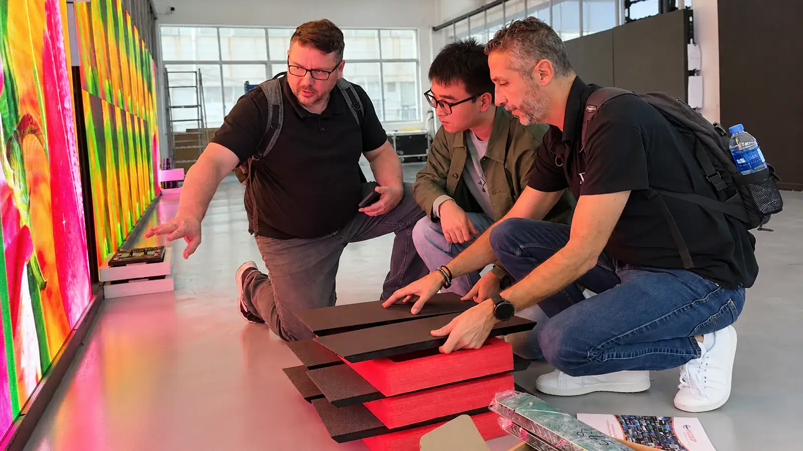 YUCHIP team reviewing LED display project requirements and technical solutions with clients