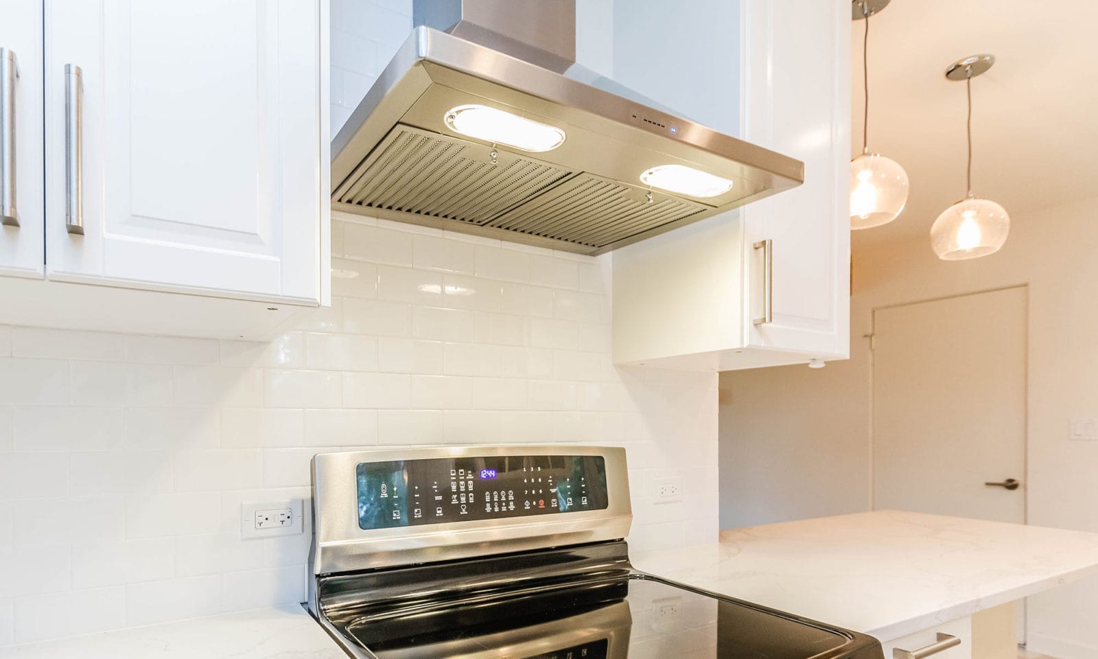 mid century modern renovation view of kitchen range and hood