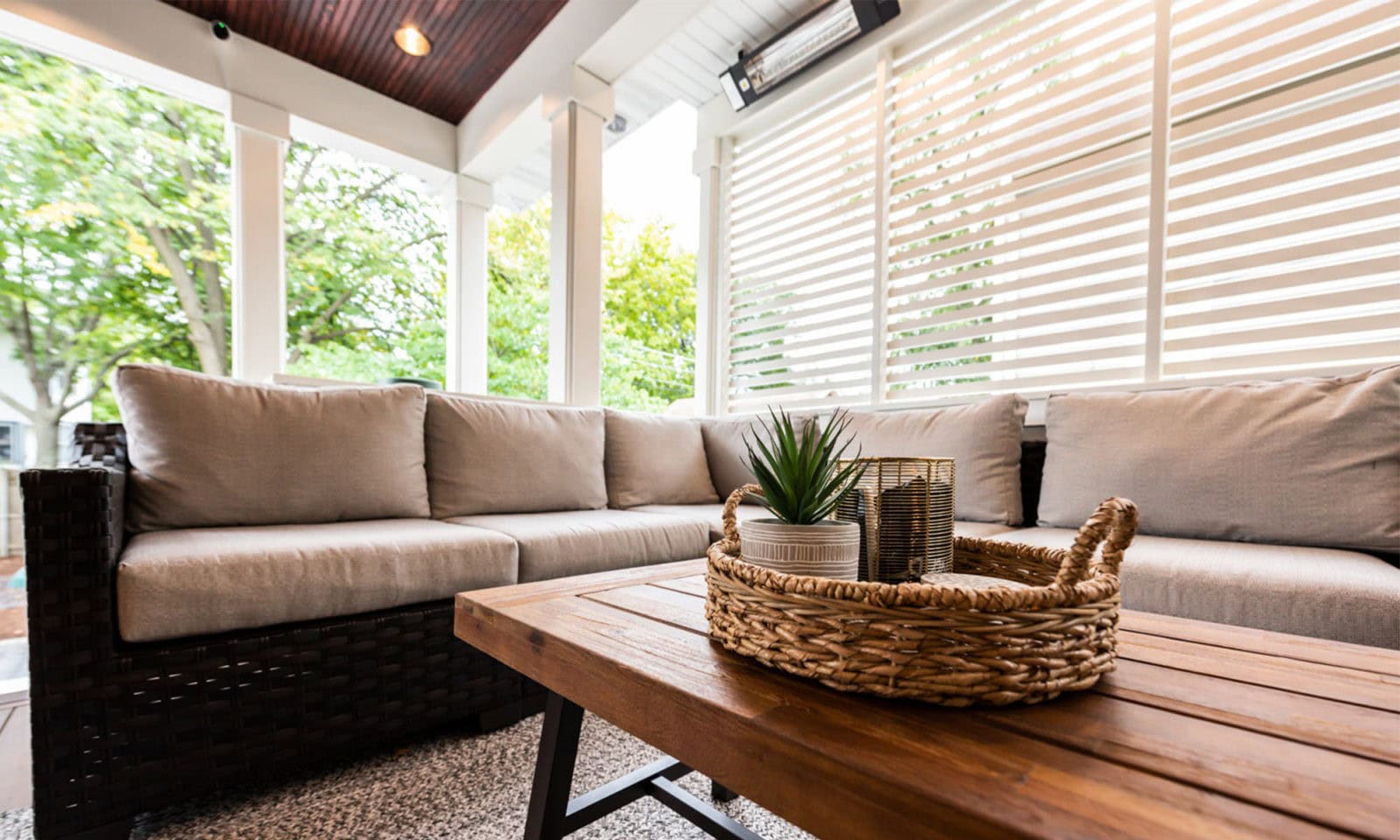 view of family on couch onn outdoor living room