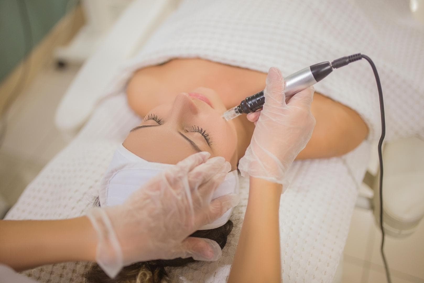 client getting microneedling treatment
