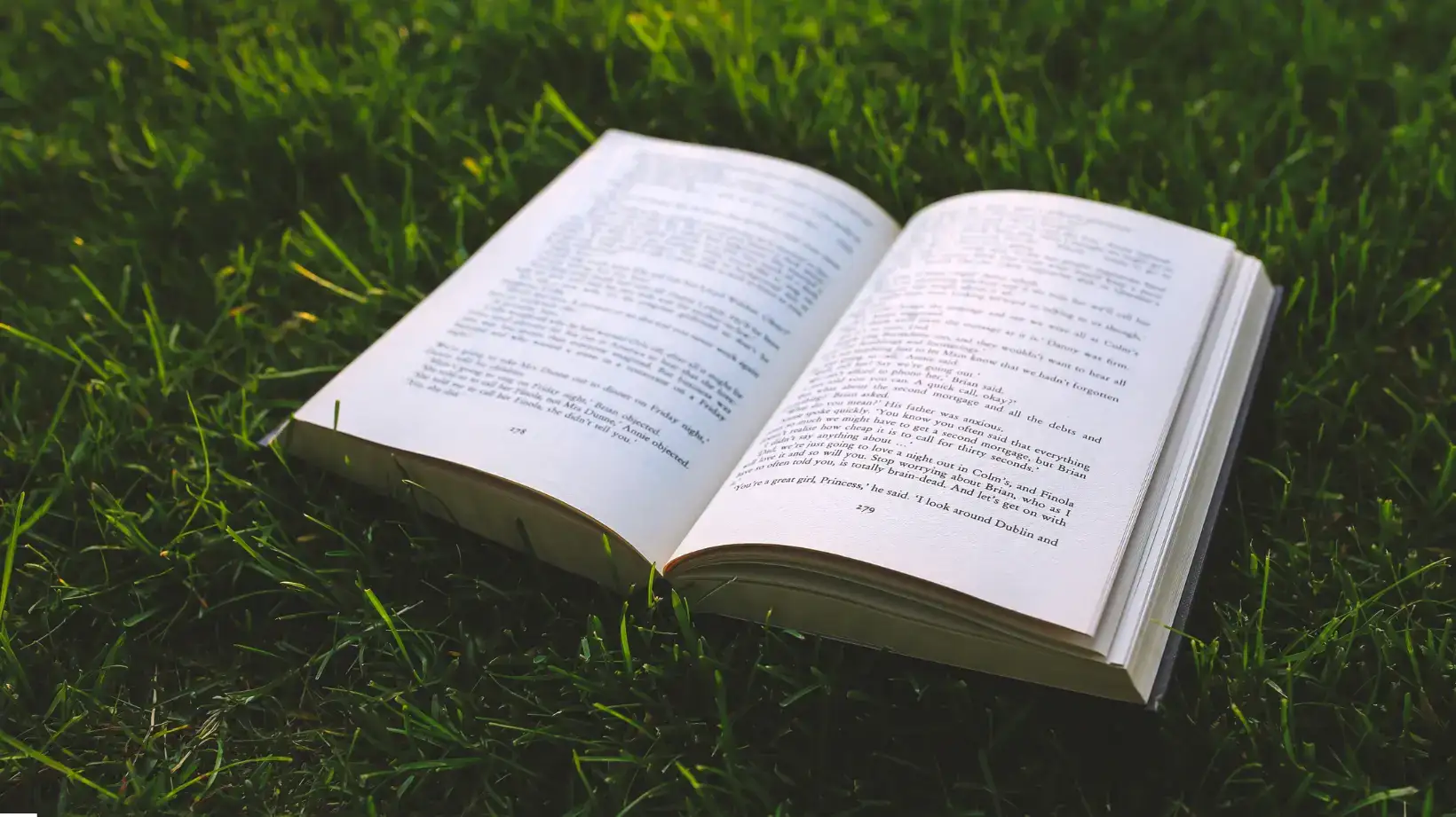 A man reading a book at the library