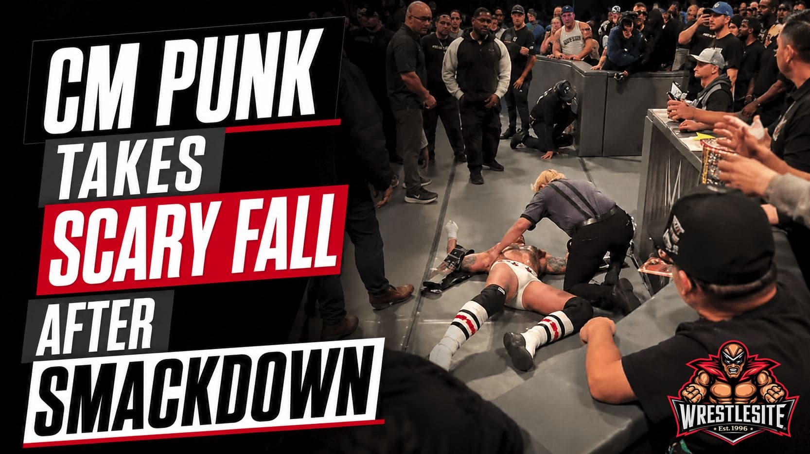 CM Punk falls at ringside after retaining WWE Championship against Kevin Owens on SmackDown Toronto