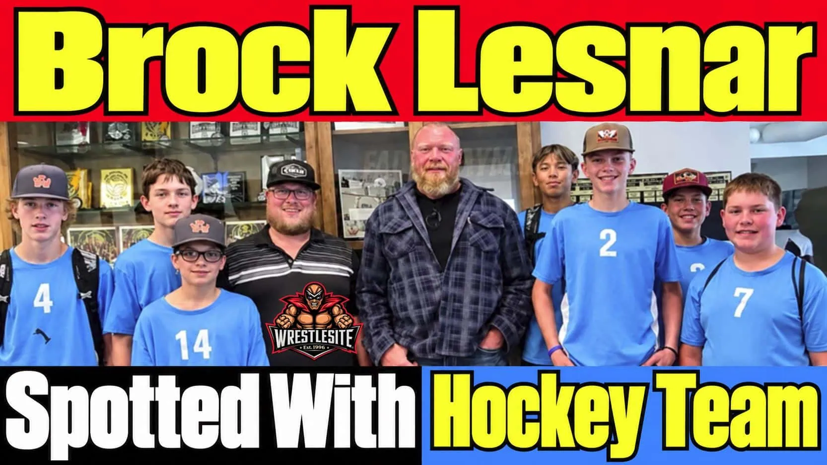 Brock Lesnar smiles with youth hockey players during first public appearance since announcing wrestling retirement