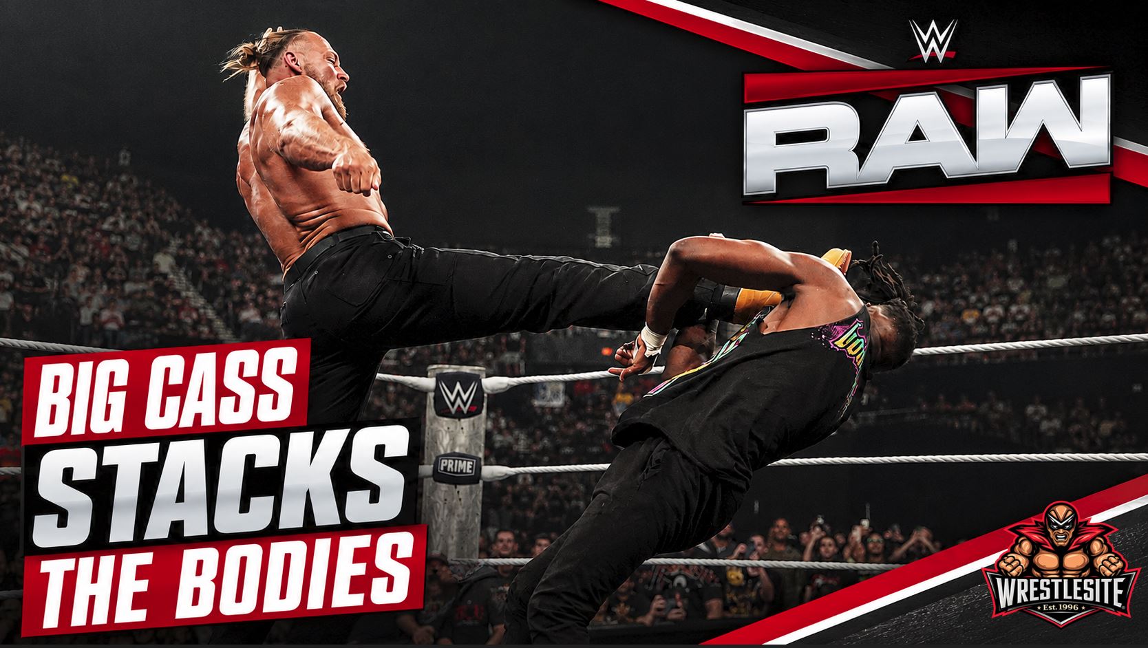Big Cass stands over Dragon Lee and Je’Von Evans following his attack on WWE RAW
