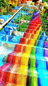 Colorful rainbow-painted stairs in Eureka Springs, Arkansas, outdoor attraction.