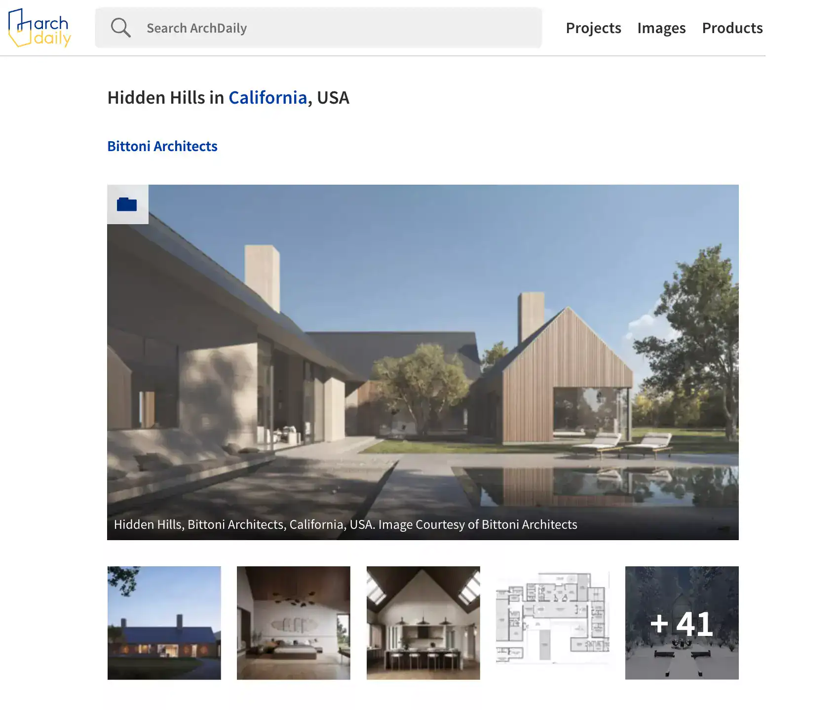 Smooth concrete and wood exterior with angular rooflines and large glass openings.