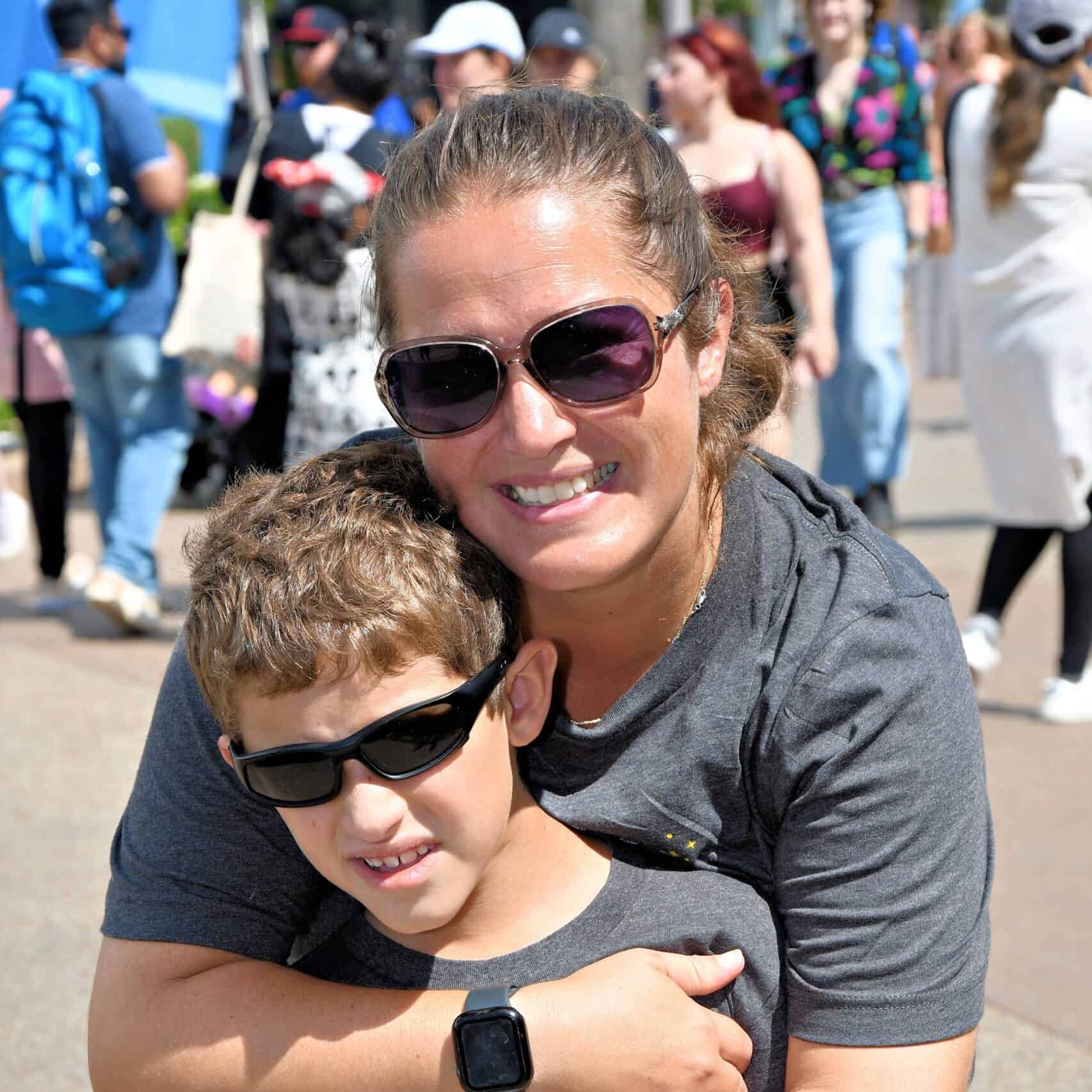 Family enjoying vacation at outdoor event with sunny weather.