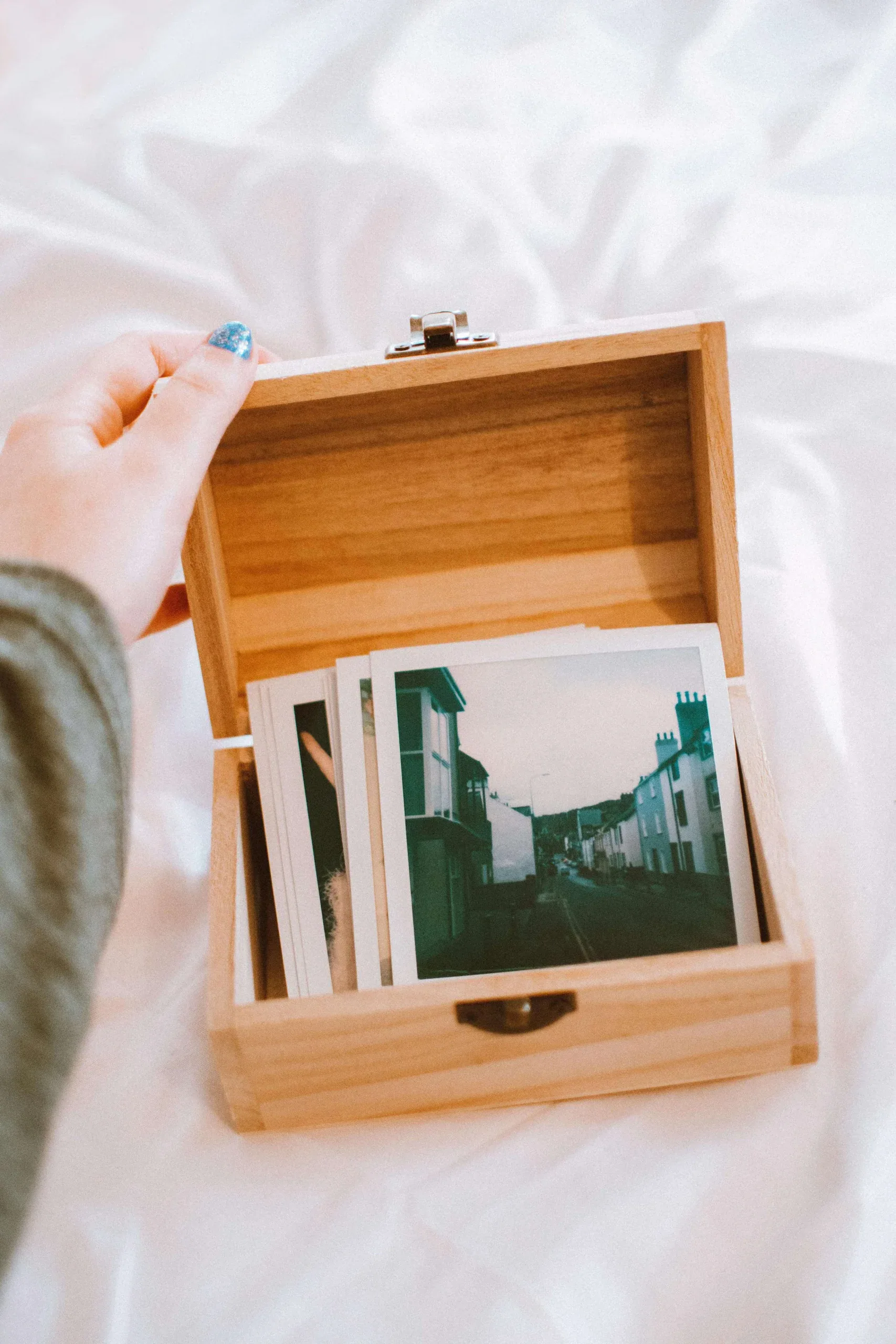 A box full of picture representing explicit trauma memories. Start trauma therapy Detroit today.