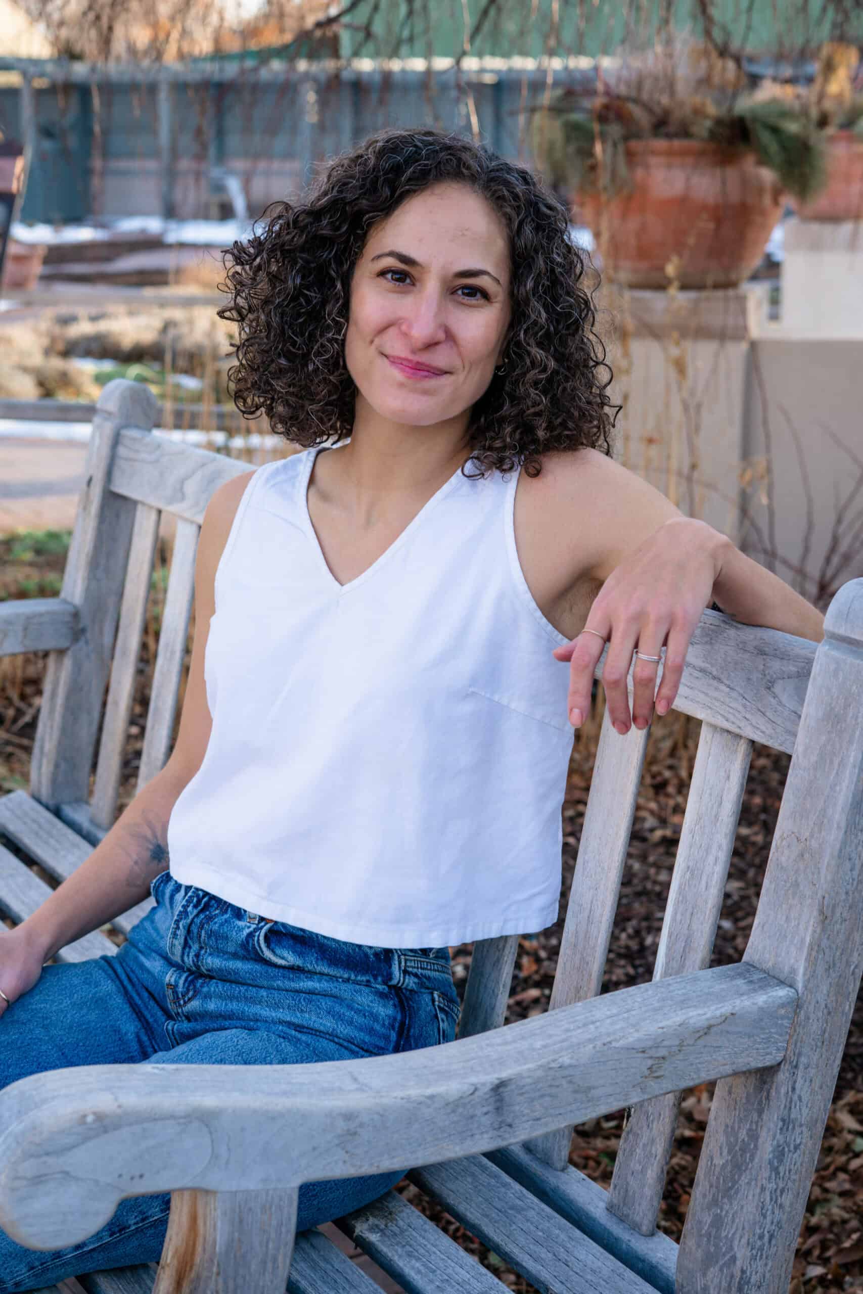 Skye Ross, EMDR Therapist in Denver, CO, poses in the Denver Botanic Gardens