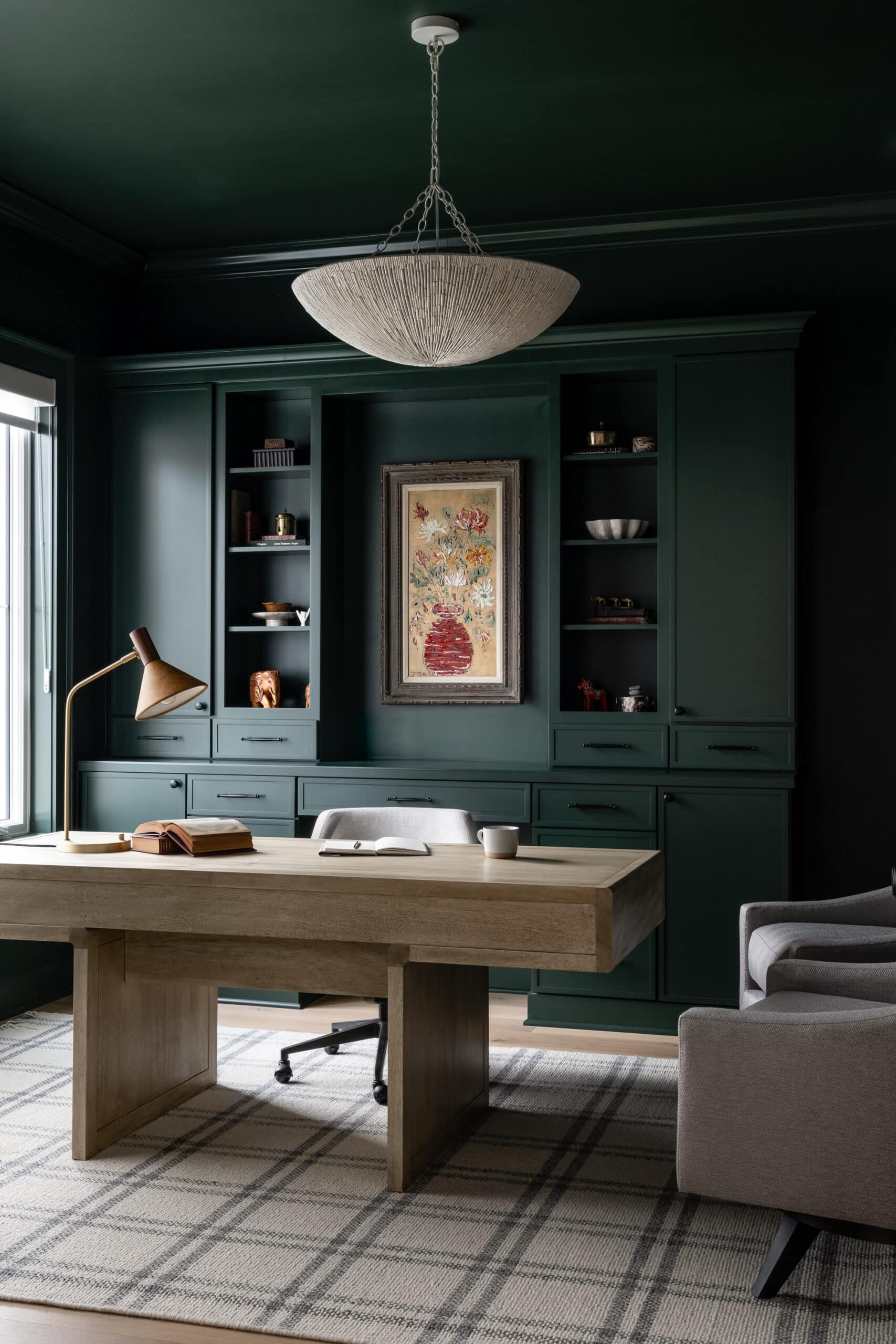 Moody home office with dark cabinetry designed by Hendrickson Interiors
