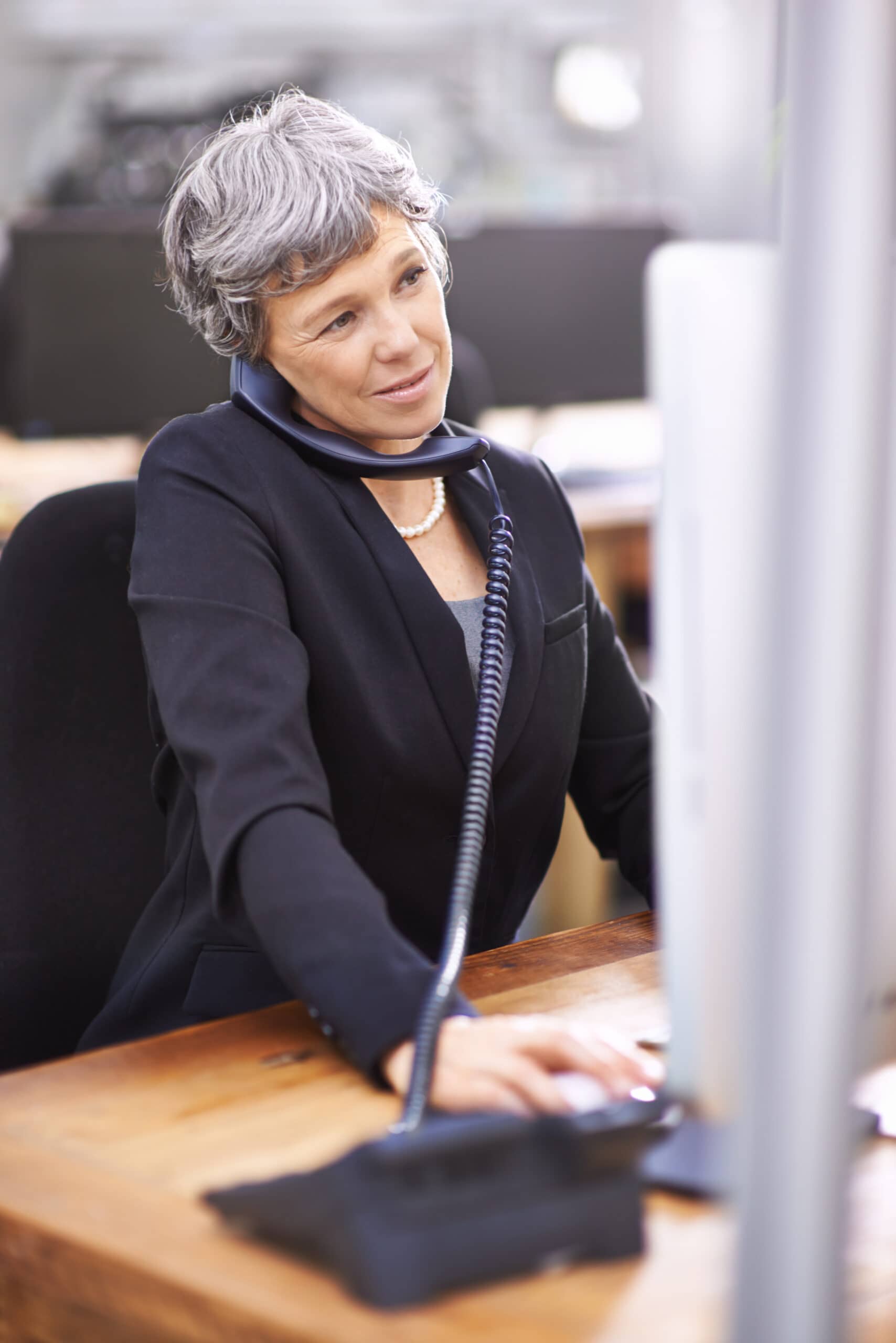 About us 3 business woman computer phone consultation call center office with typing web advice crm company conversation professional senior person with technology telemarketing scaled