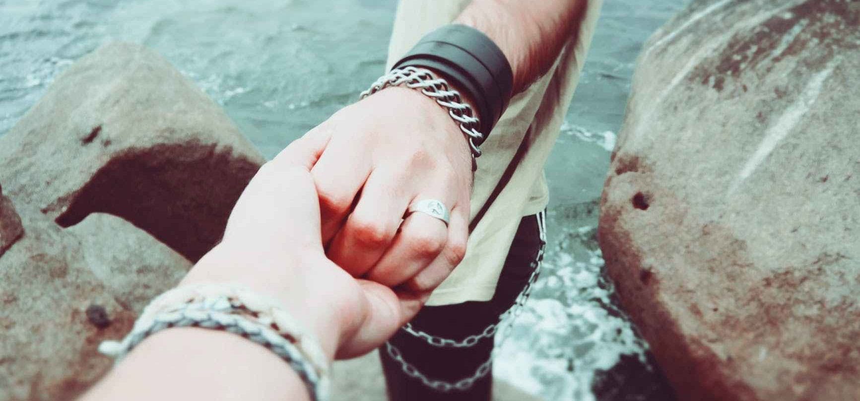 couple holding hands love people