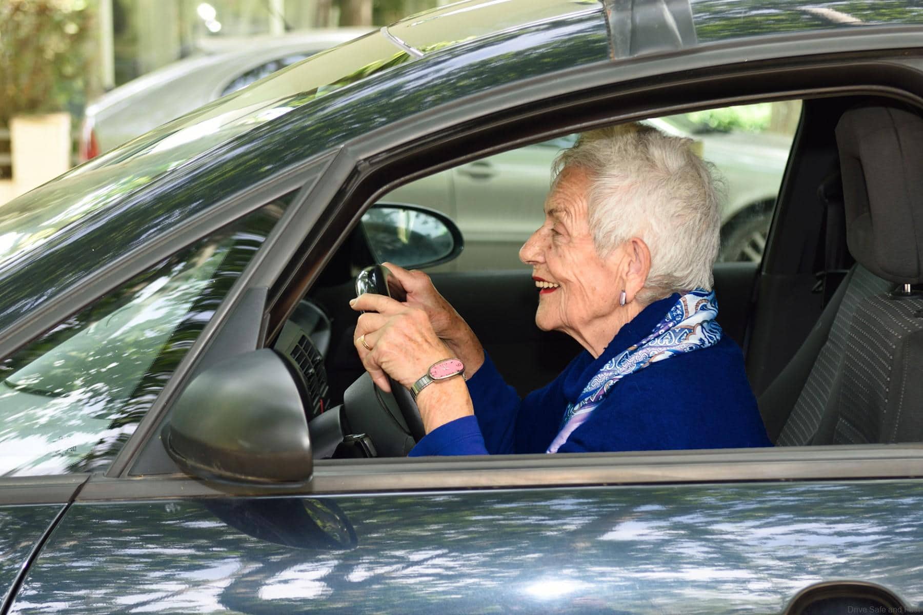 Seniors driving: a senior citizen driving a car