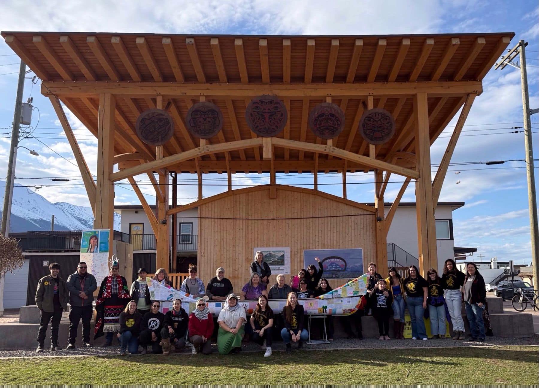 Wet'suwet'en Land Defenders and Amnesty International standing with solidarity letters canoe during Write for Rights Letter Delivery Event, Smithers BC. © Alli McCracken/Amnesty International.