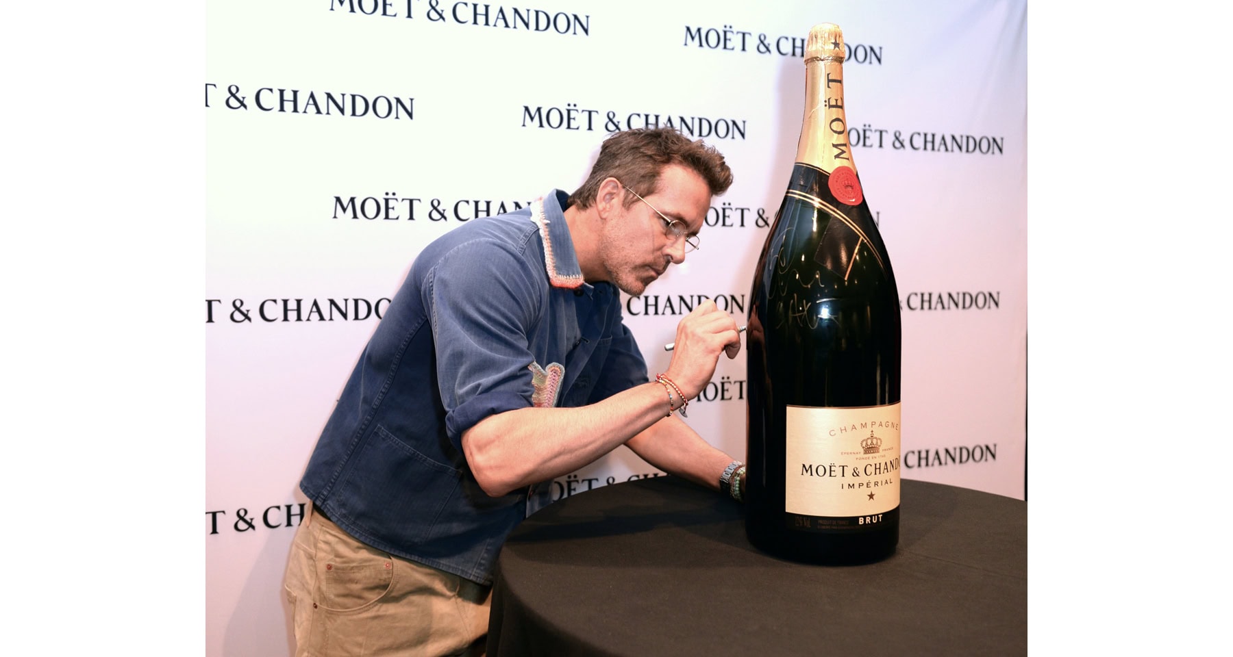 TIFF Celeb Watch: Stars Unite Over Charity Signing of Huge Bottle of Moët & Chandon