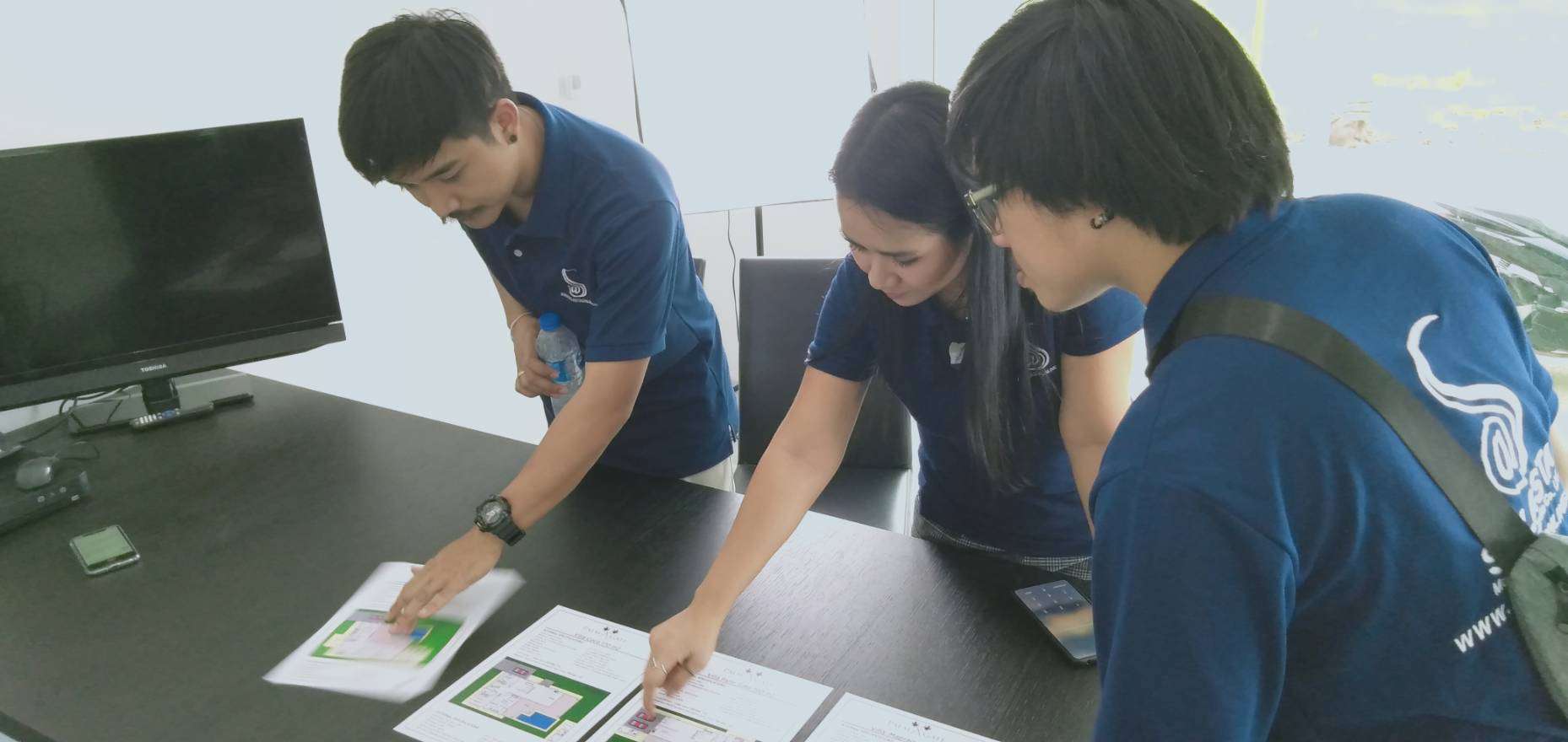 Solasta Marketing team reviewing project plans together