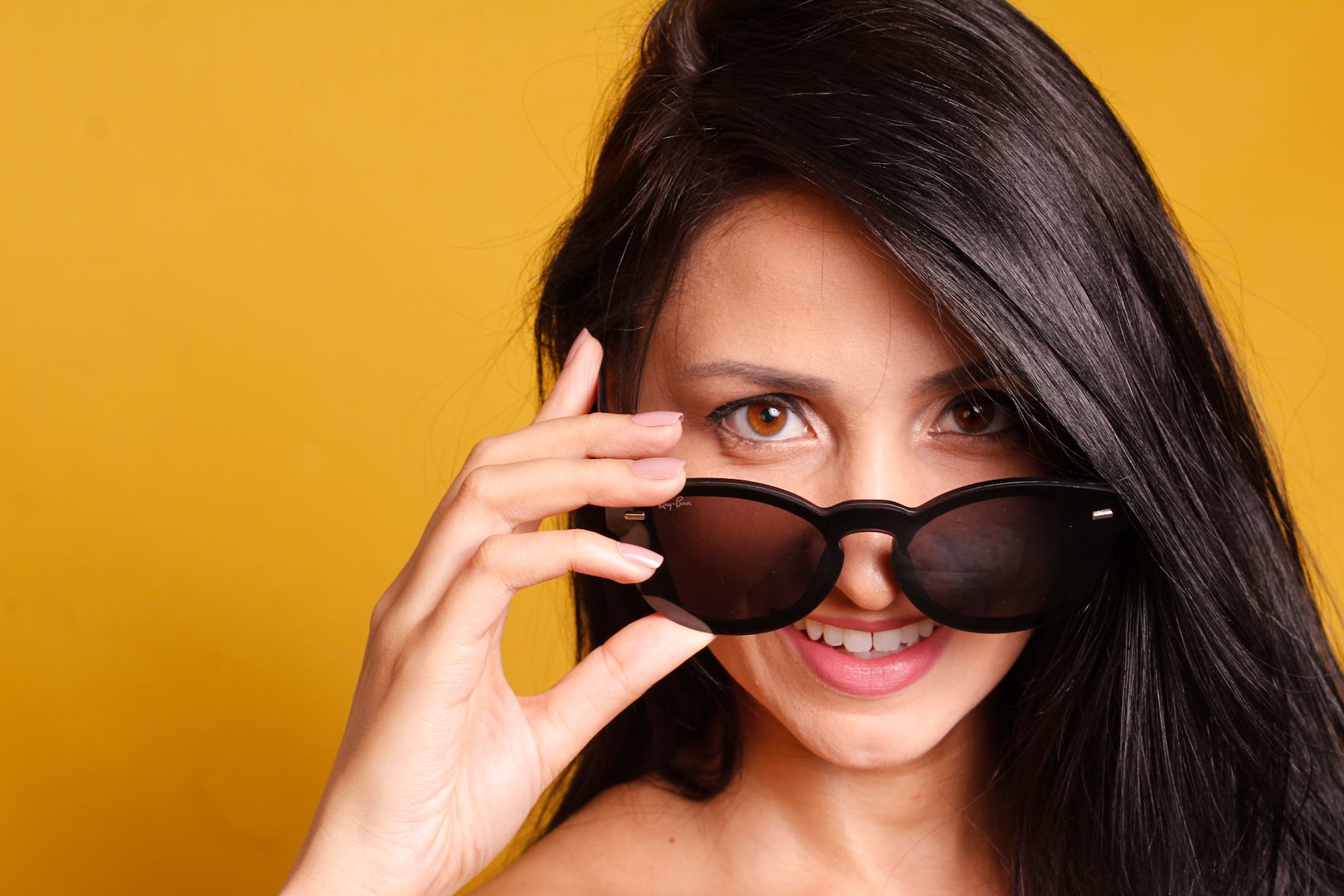 smiling woman wearing black sunglasses