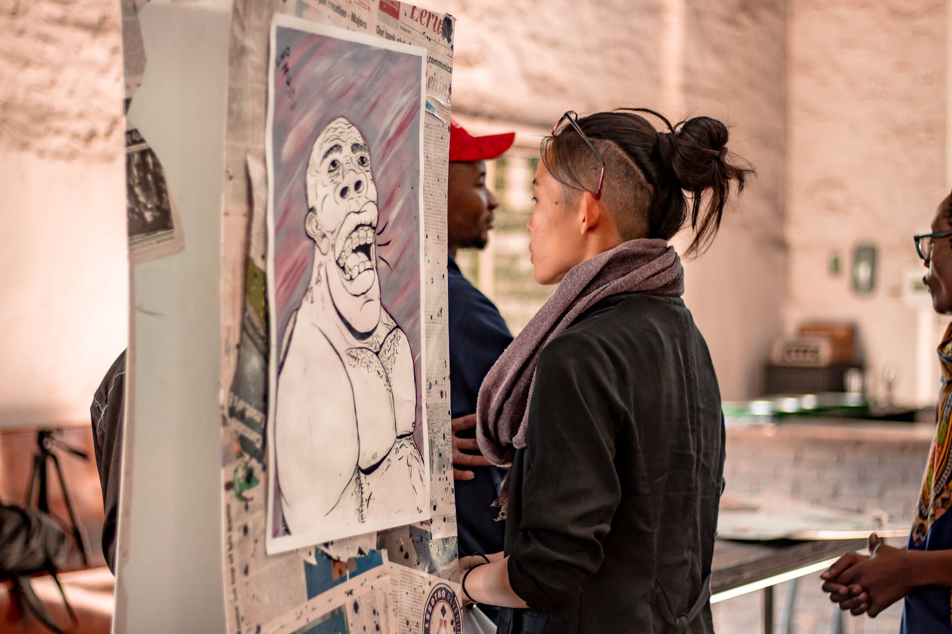 People in conversation at a gallery gathering