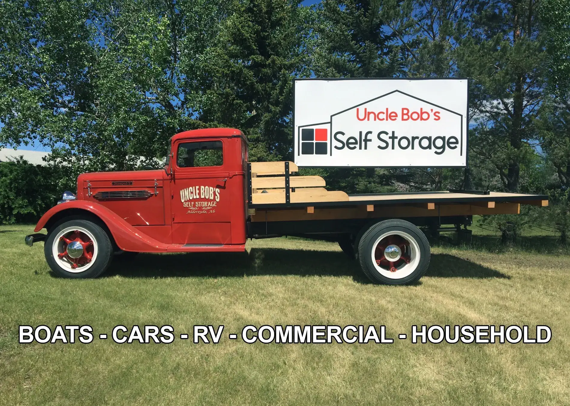 A red Uncle Bob's moving truck parked at our secure mini storage facility in Okotoks.