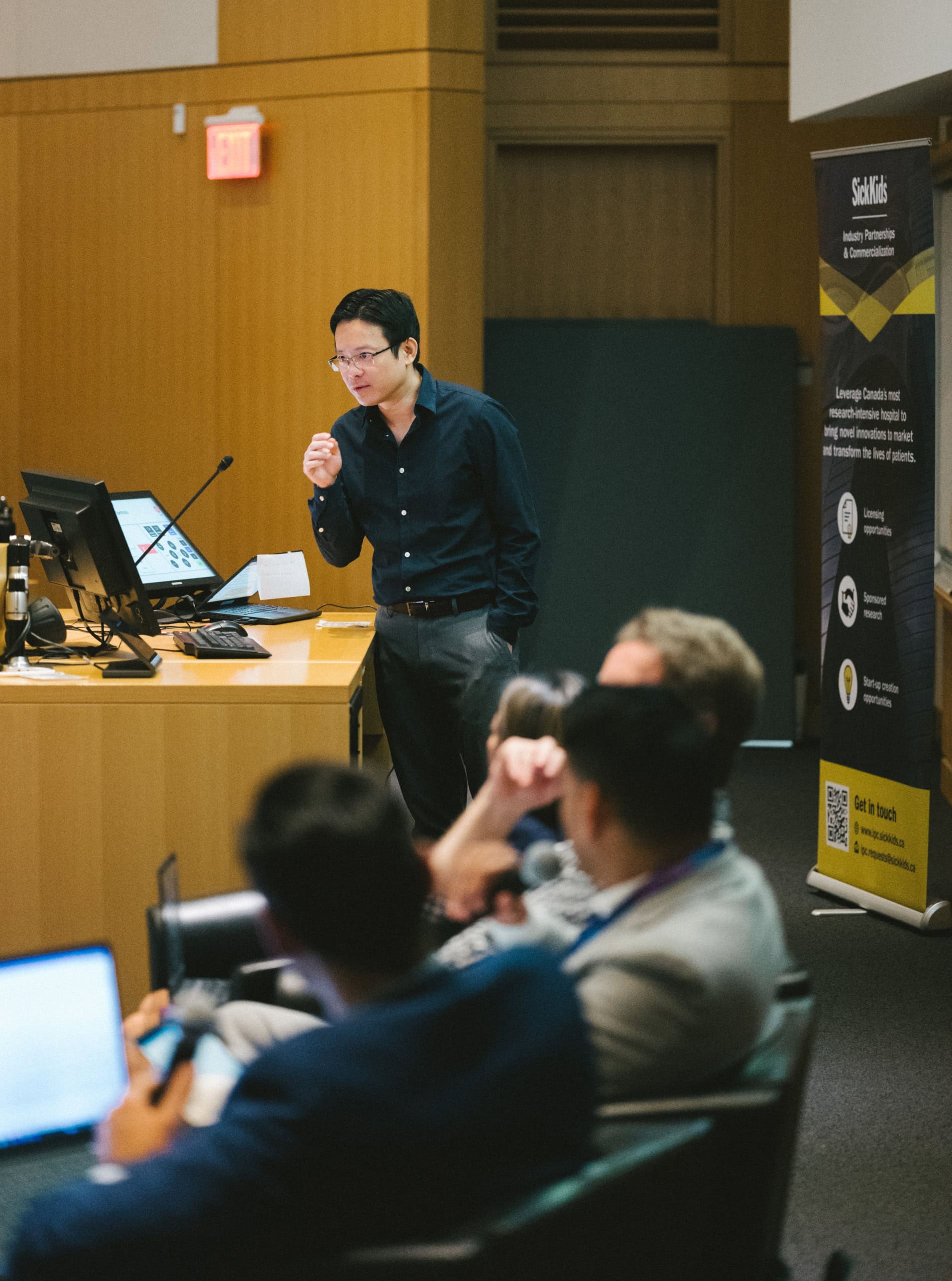 Dr. Huang pitches his project in front of a panel of industry experts at the 2024 SickKids Innovation Showcase