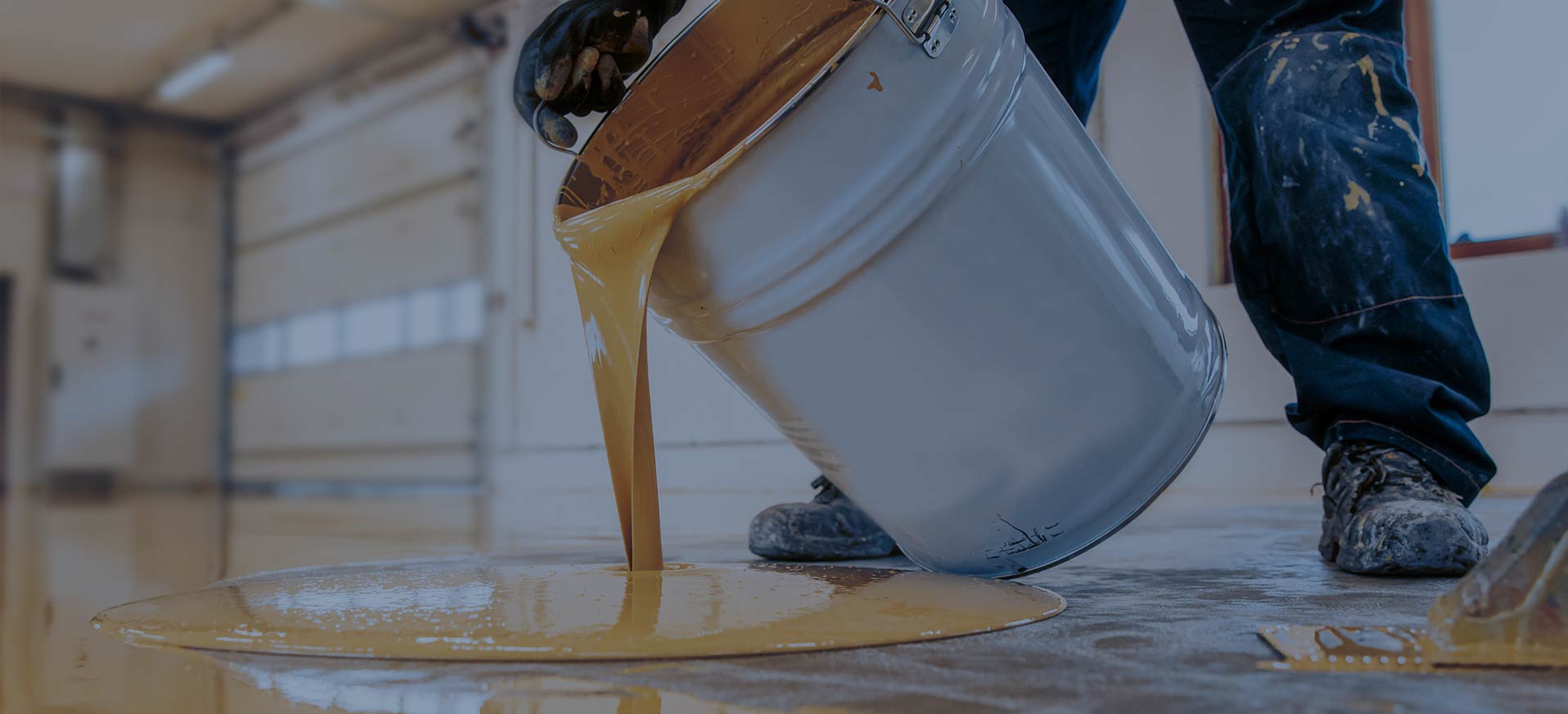 Reliable Application of High-Quality Resins Worker pouring synthetic resins from a bucket onto the floor with the title: