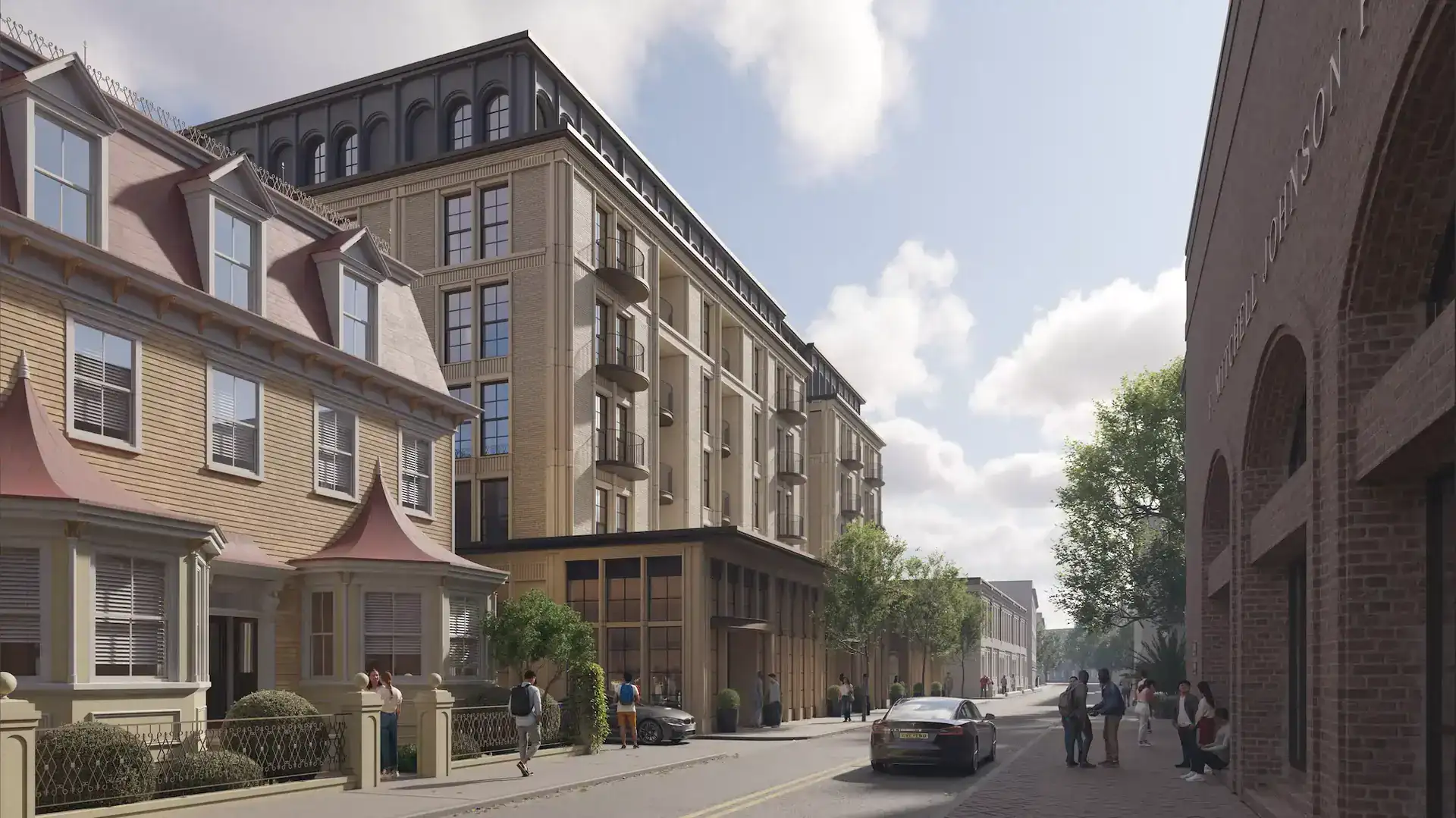 Modern mixed-use building with a beige stone facade, large glass windows, and small balconies featuring rounded railings.