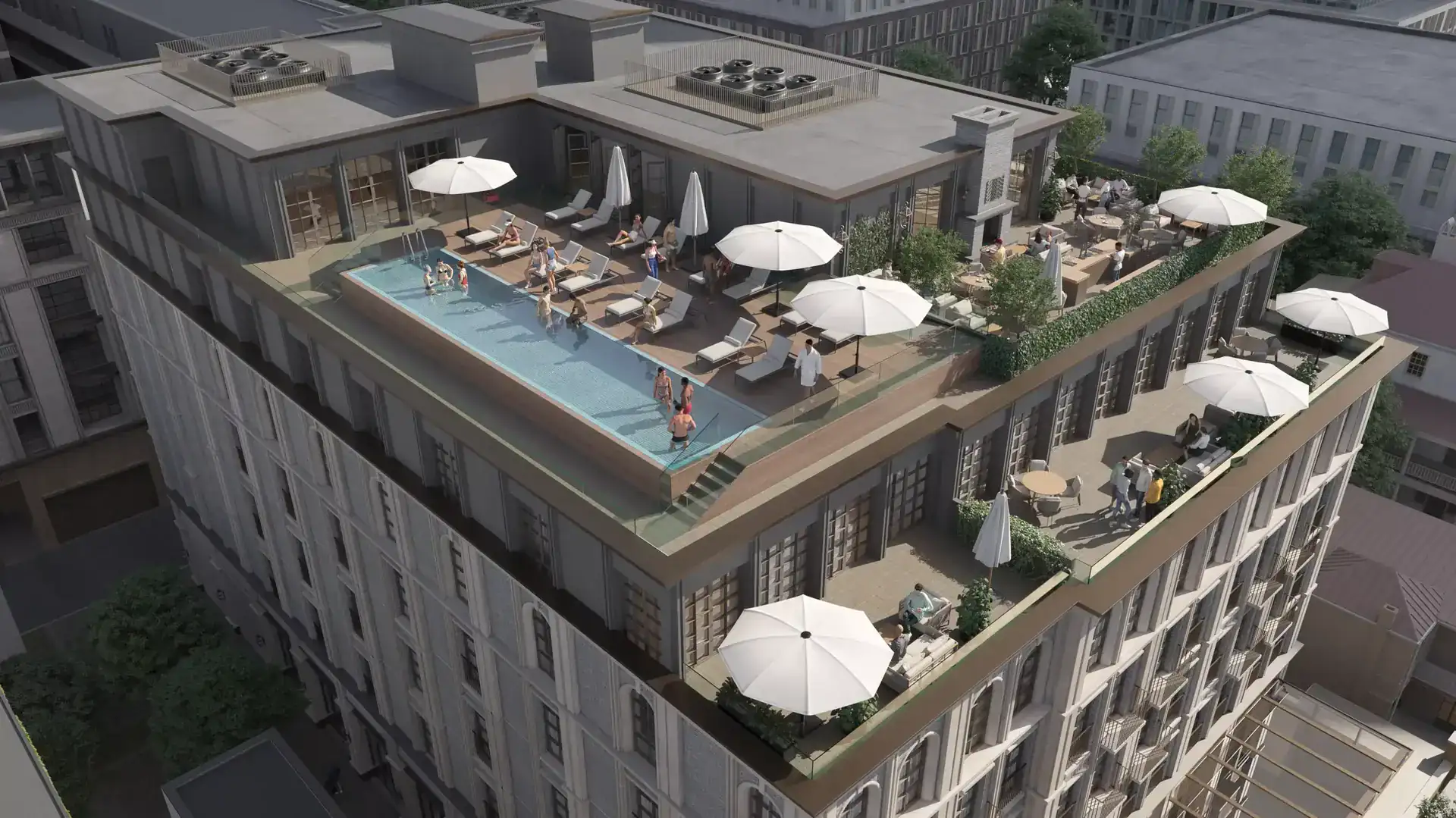 Rooftop pool area with sun loungers, umbrellas, and outdoor seating, atop a modern high-rise building in an urban setting.