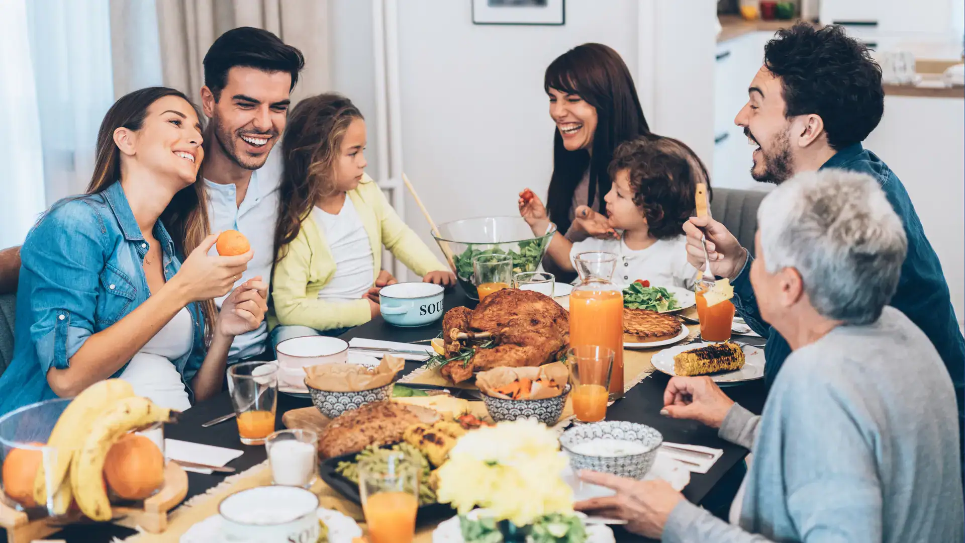 A family eats Thanksgiving dinner