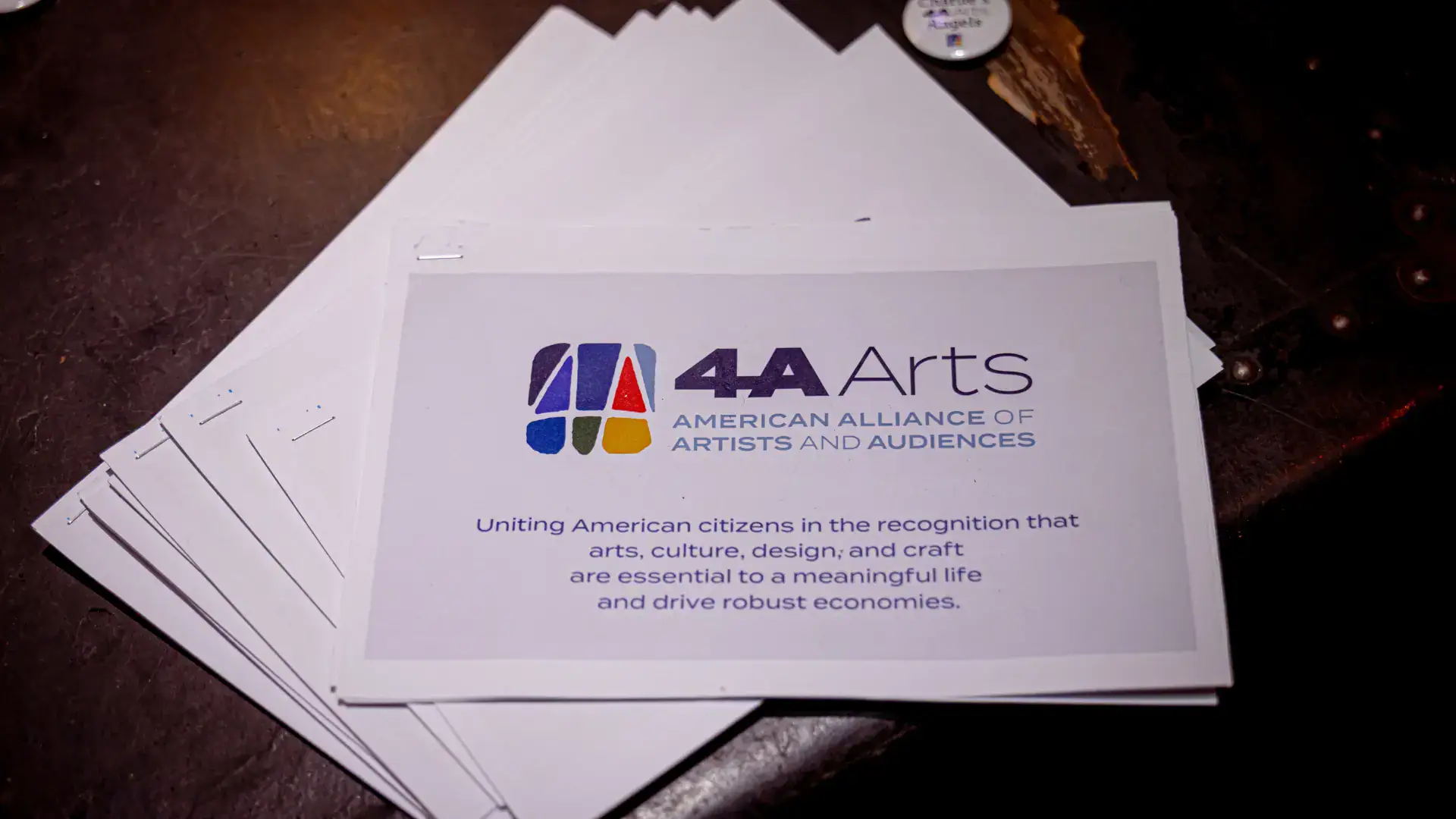 Informational packets about the 4A Arts mission and programming