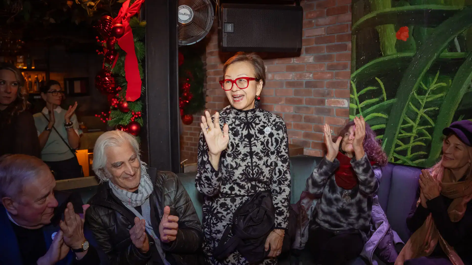 Board Member Ruby Shang waves to friends
